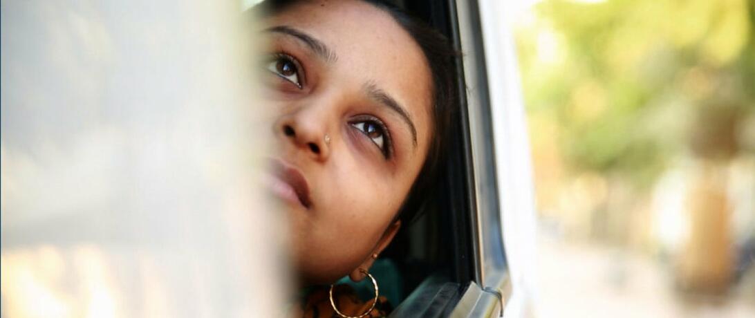 Woman looking out of a window